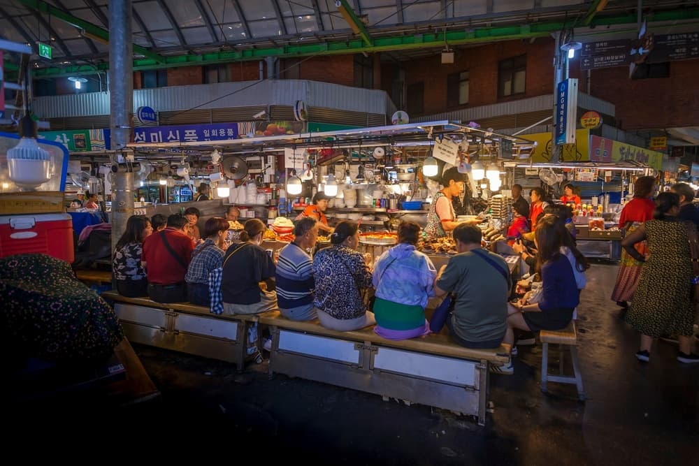People dining on the Gwangjang Market one of the biggest food markets in Seoul