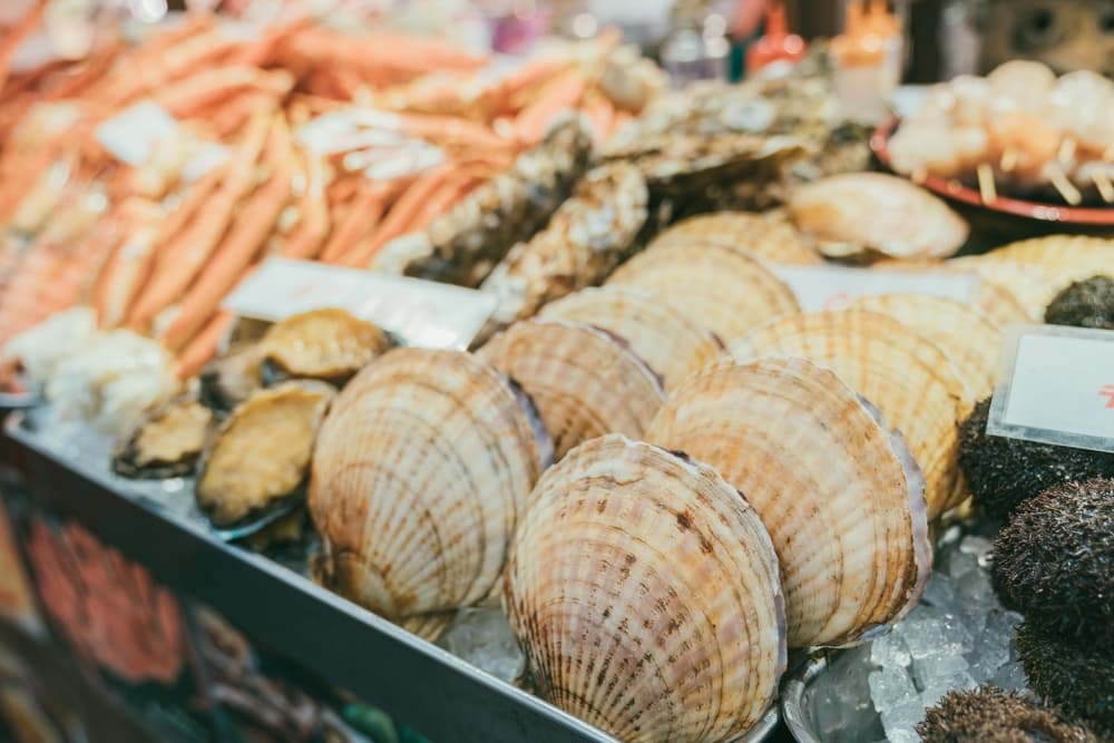 seafood grill stall in kuromon ichiba market in Osaka japan