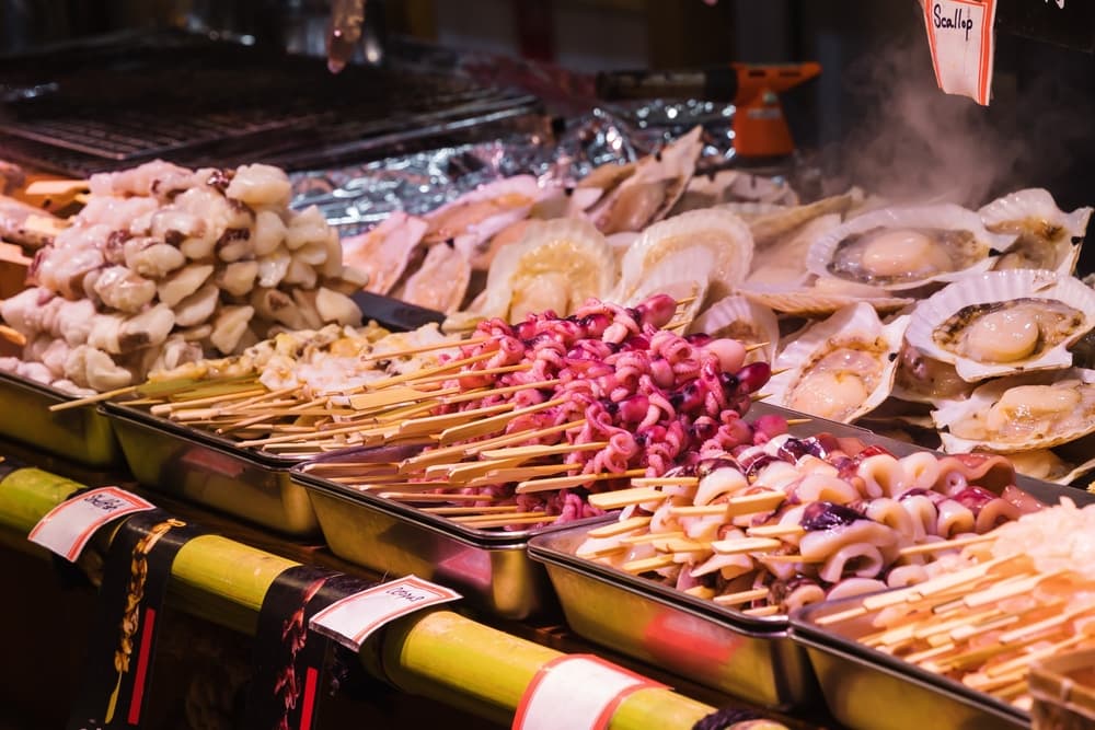 Display of raw seafood at the famous Nishiki fish market in Kyoto, Japan