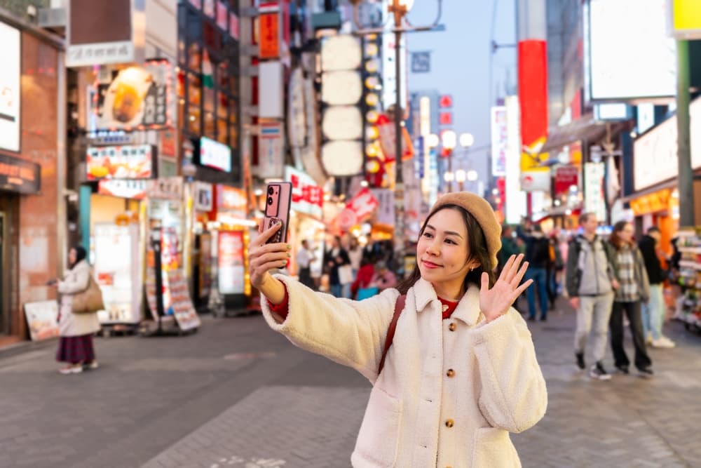 a tourist in Dotonbori, Osaka, Japan