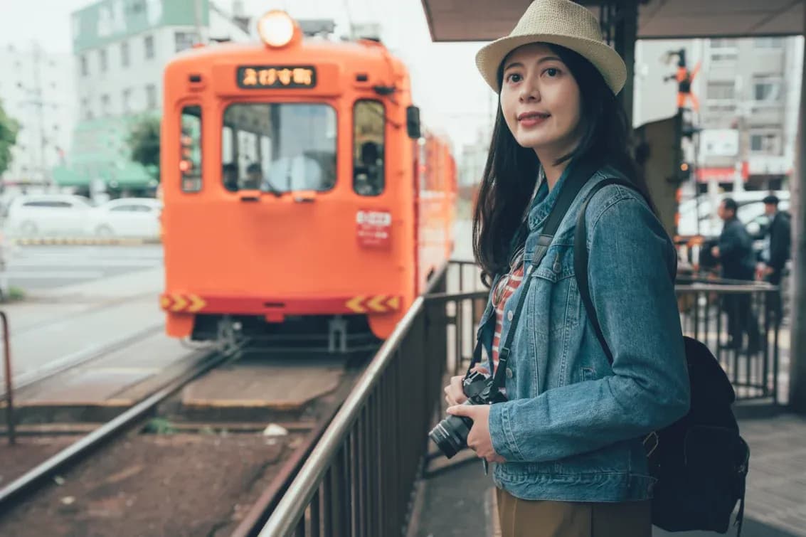 woman-waiting-for-a-train-at-train-station-in-osaka